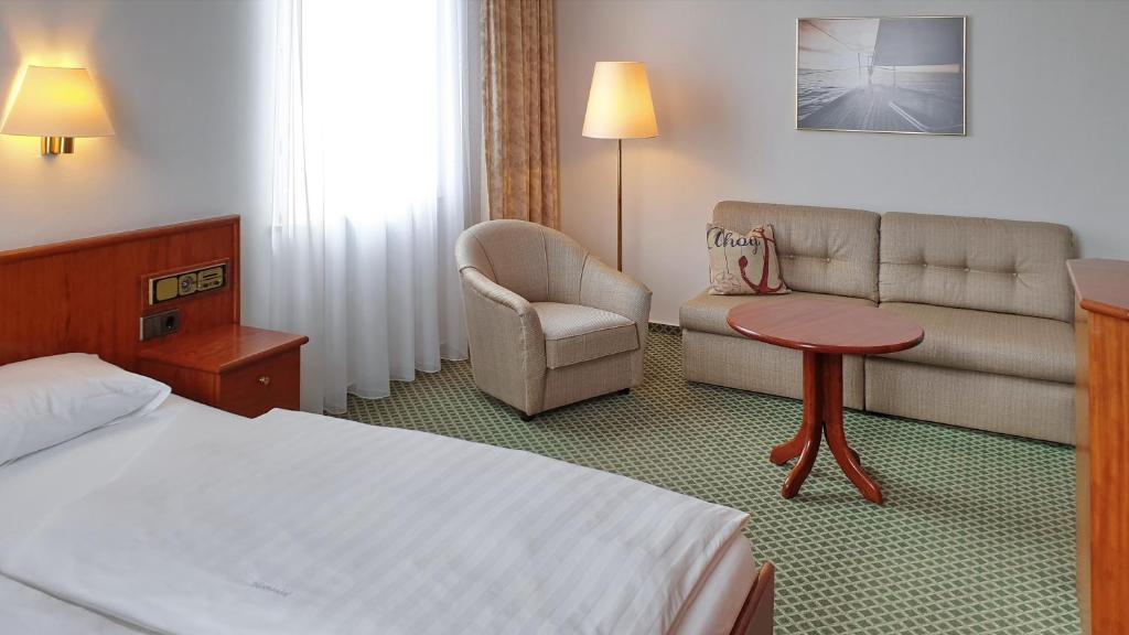 Postel nebo postele na pokoji v ubytování Hotel Westfalenhof