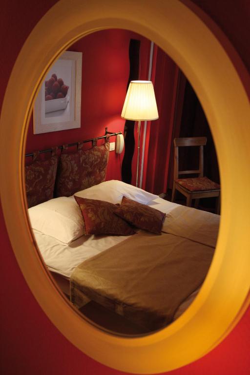 Postel nebo postele na pokoji v ubytování Le Kléber Hôtel
