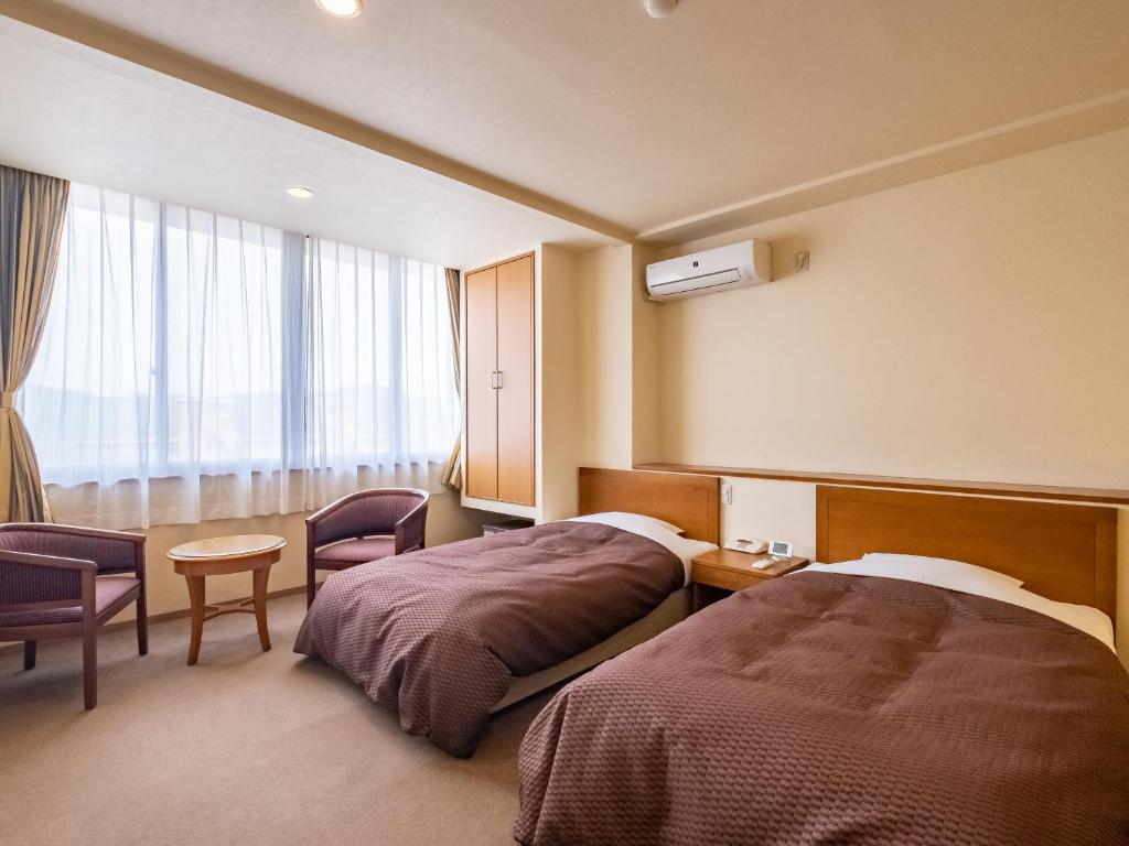 Una cama o camas en una habitación de HAKONE GORA ONSEN Hotel Kasansui