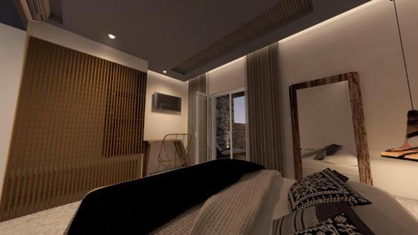 Postel nebo postele na pokoji v ubytování AELLIA HOTEL & SUITES LEROS