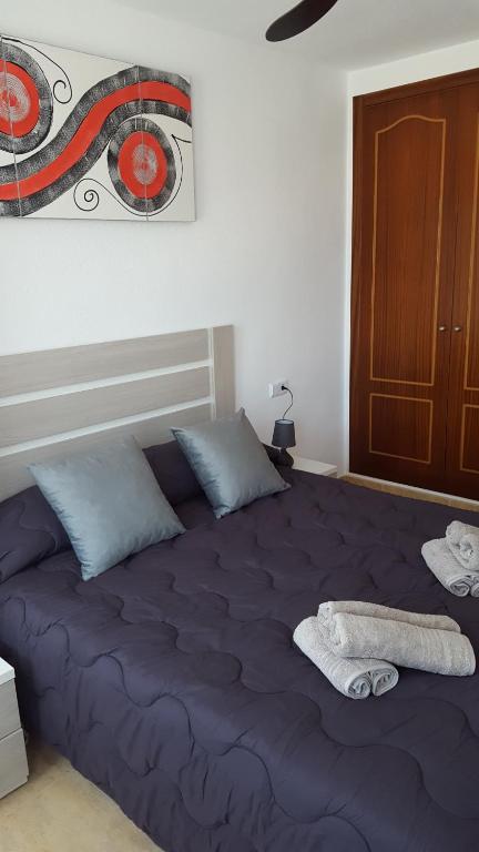 Posteľ alebo postele v izbe v ubytovaní Apartamento Arosa Playa