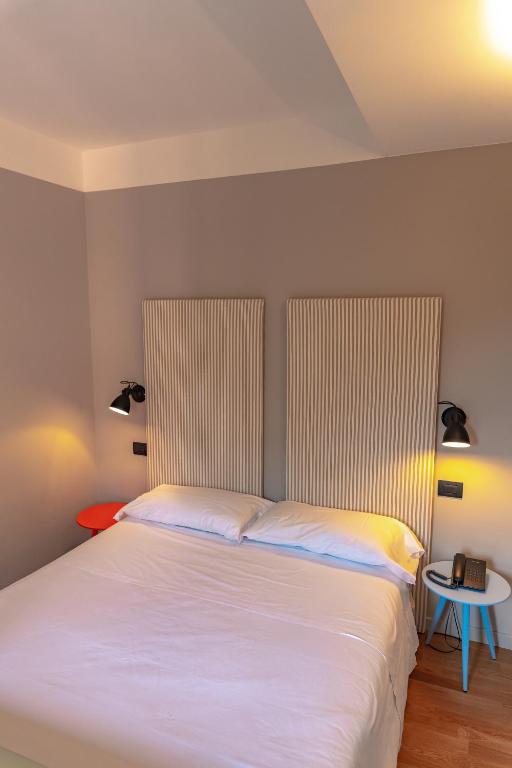 Postel nebo postele na pokoji v ubytování Hotel Moderno
