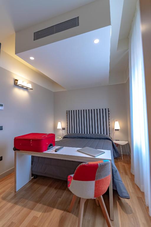 Postel nebo postele na pokoji v ubytování Hotel Moderno