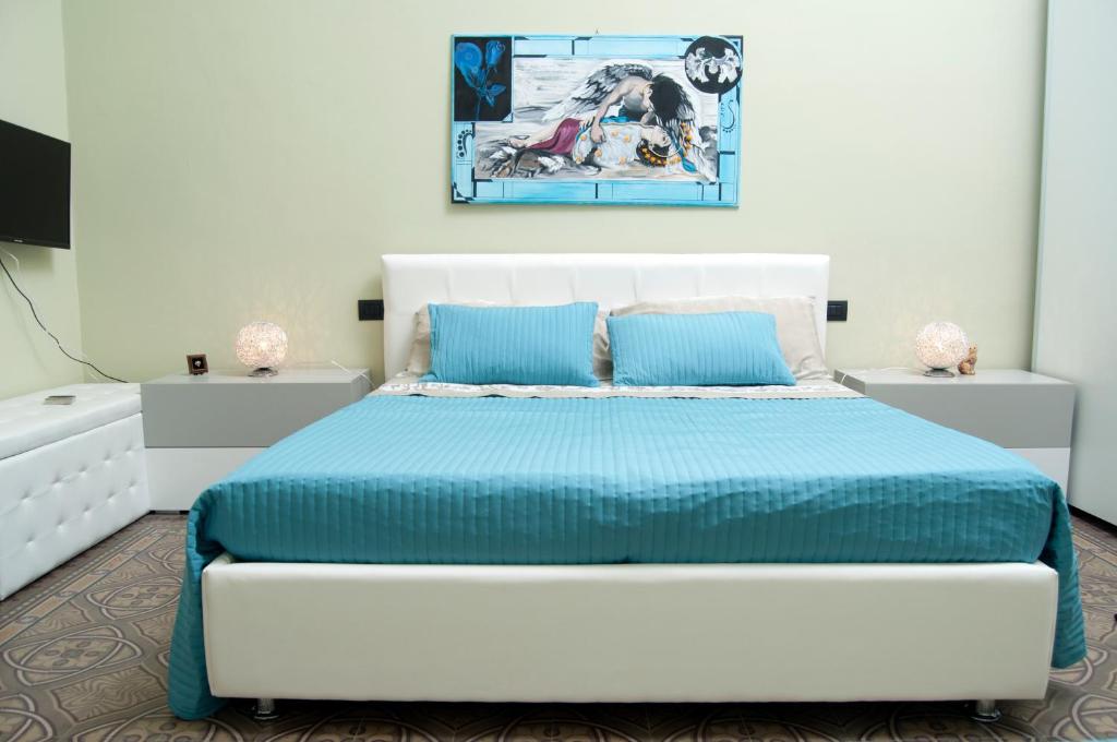 Łóżko lub łóżka w pokoju w obiekcie B&B Villa Roma