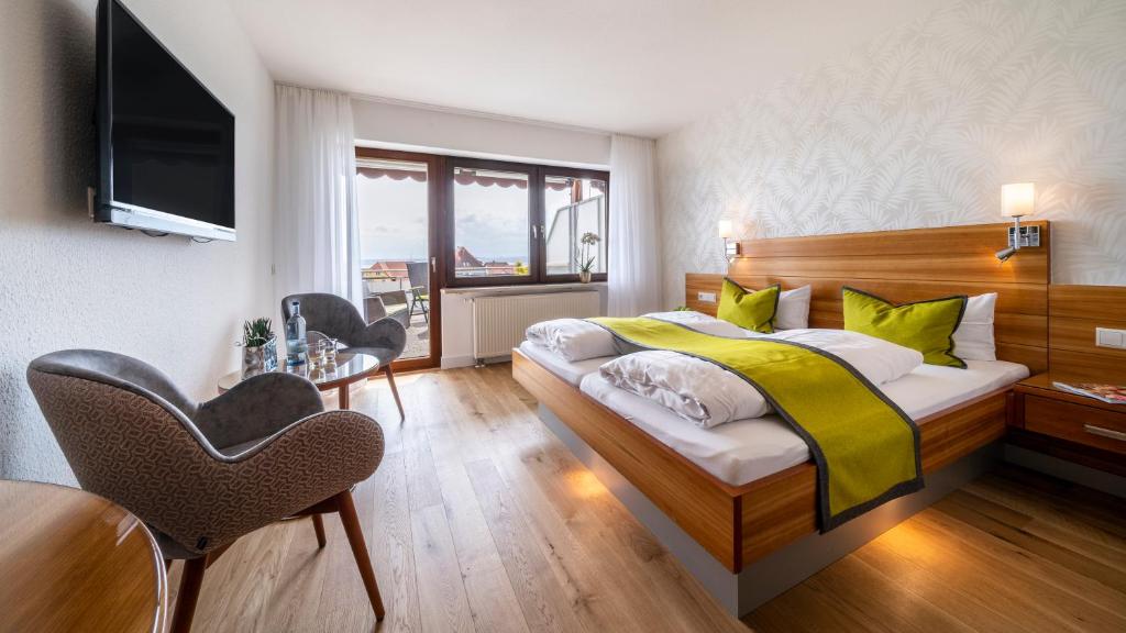Postel nebo postele na pokoji v ubytování Hotel Restaurant Hansjakob