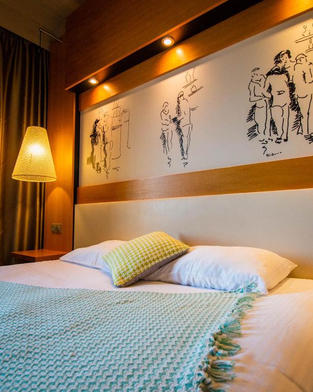 Postel nebo postele na pokoji v ubytování Le Safari Hotel Restaurant