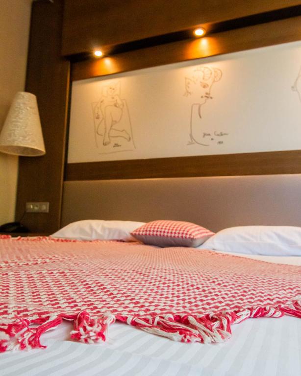 Postel nebo postele na pokoji v ubytování Le Safari Hotel Restaurant