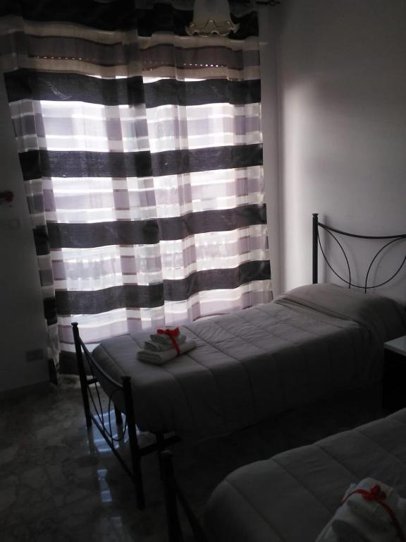 Postel nebo postele na pokoji v ubytování B&B Lo Scrigno