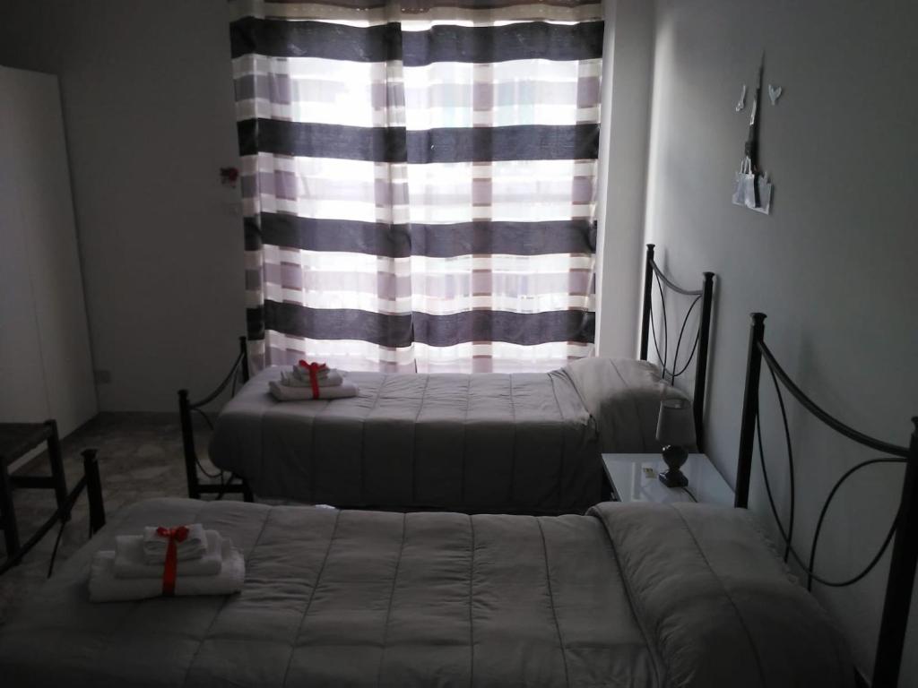 Postel nebo postele na pokoji v ubytování B&B Lo Scrigno