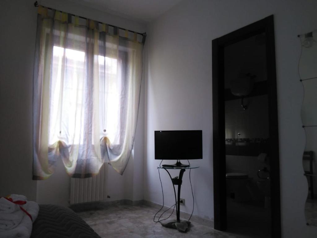 TV a/nebo společenská místnost v ubytování B&B Lo Scrigno
