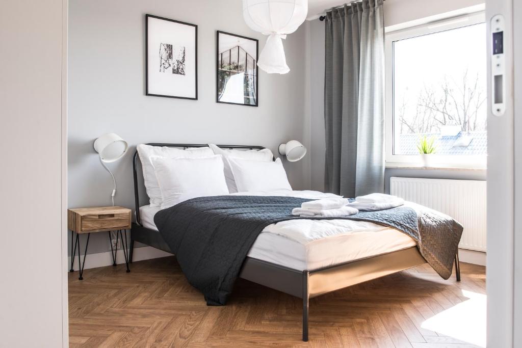 Posteľ alebo postele v izbe v ubytovaní Apartament przy Zachodnim