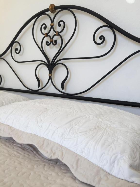 Postel nebo postele na pokoji v ubytování B&B Casa Del Priore