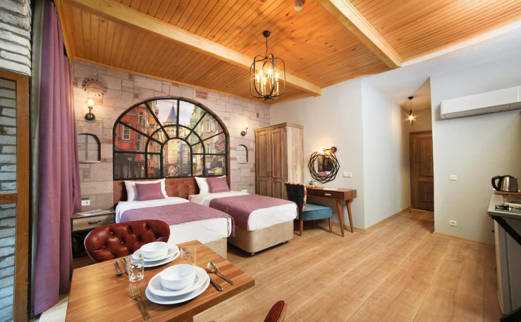 Postel nebo postele na pokoji v ubytování Ardilas Residence