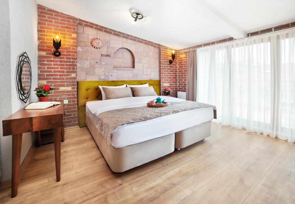 Postel nebo postele na pokoji v ubytování Ardilas Residence