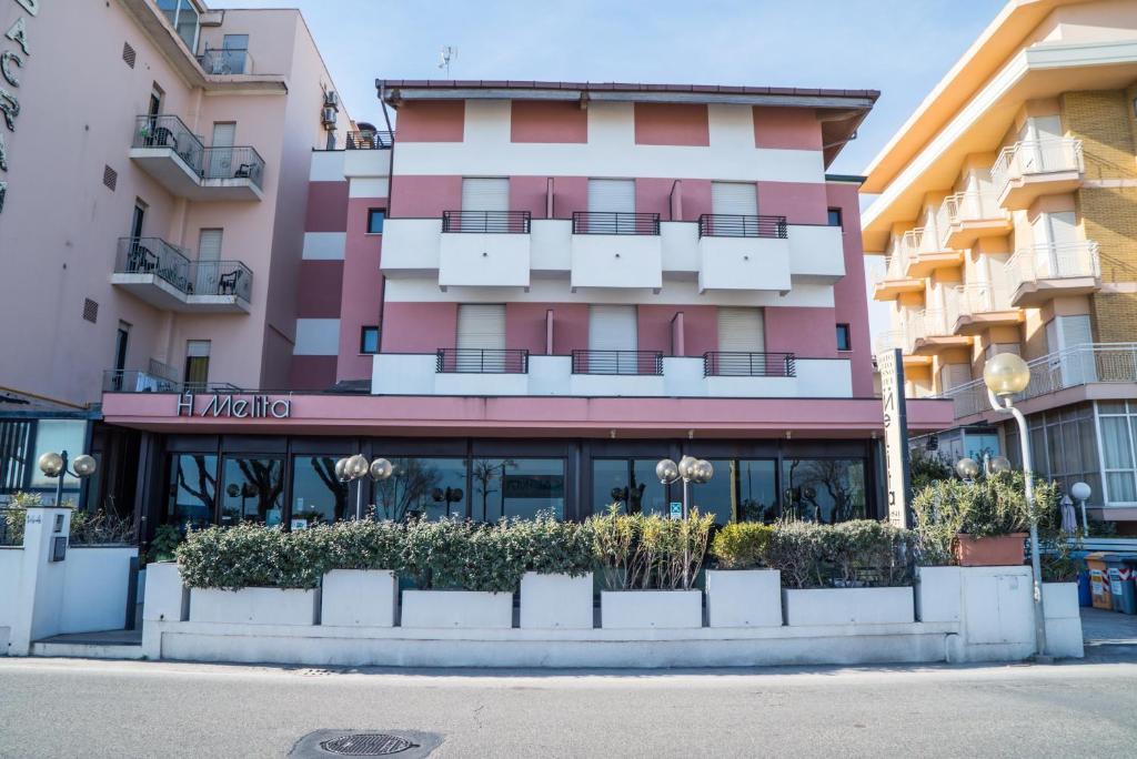 a building in front of a building at Hotel Melita in Rimini