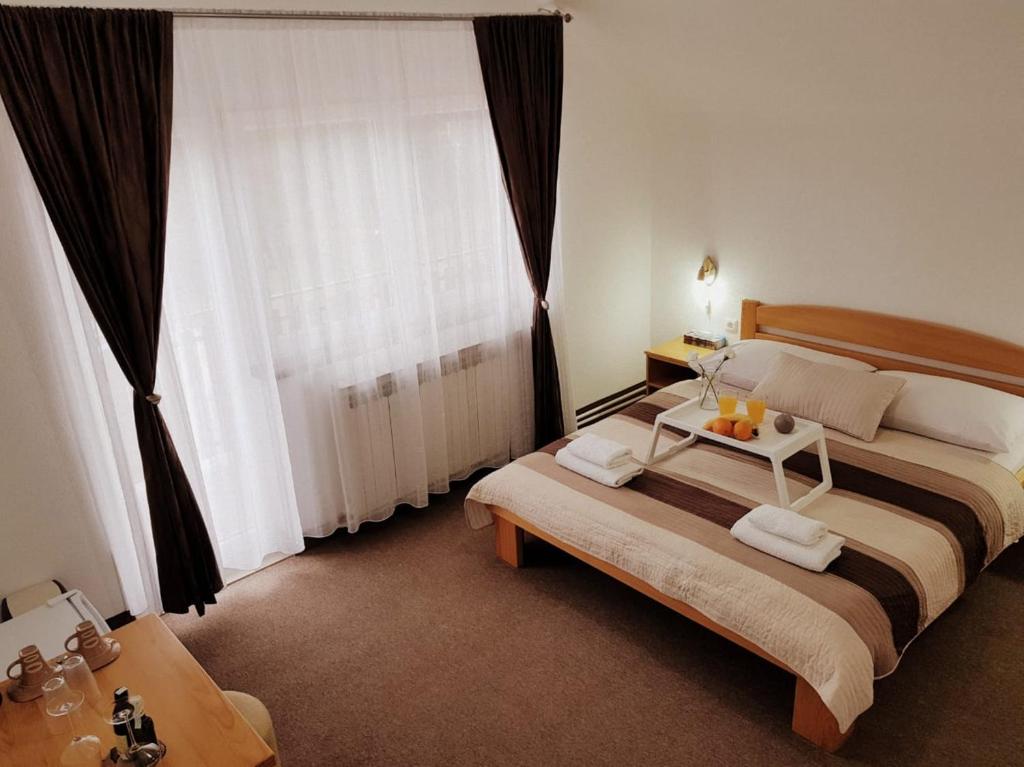 Postel nebo postele na pokoji v ubytování Guesthouse Kovačević