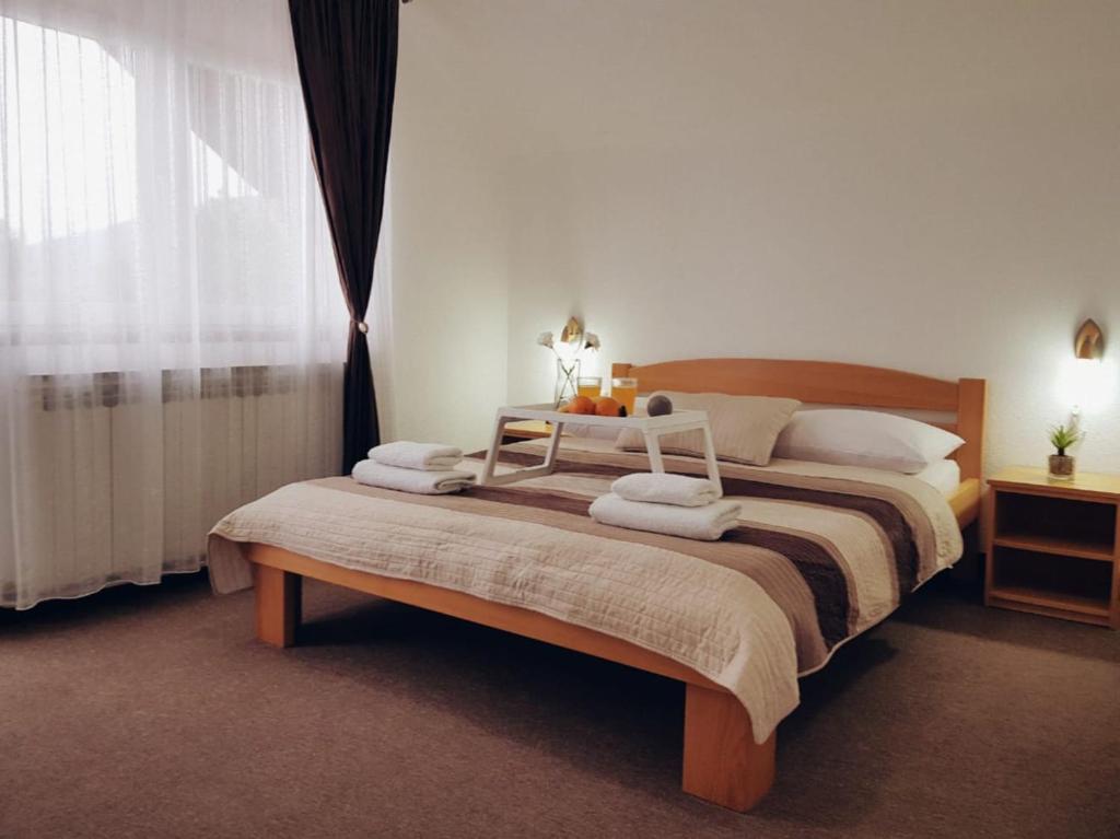 Postel nebo postele na pokoji v ubytování Guesthouse Kovačević