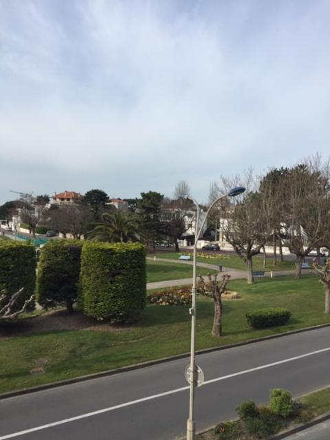 a street light on the side of a road at Hôtel Beau Rivage in Royan