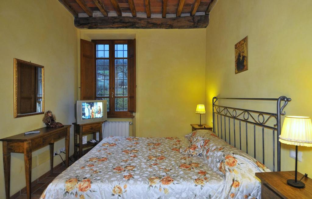 A bed or beds in a room at Le Ginestre B & B
