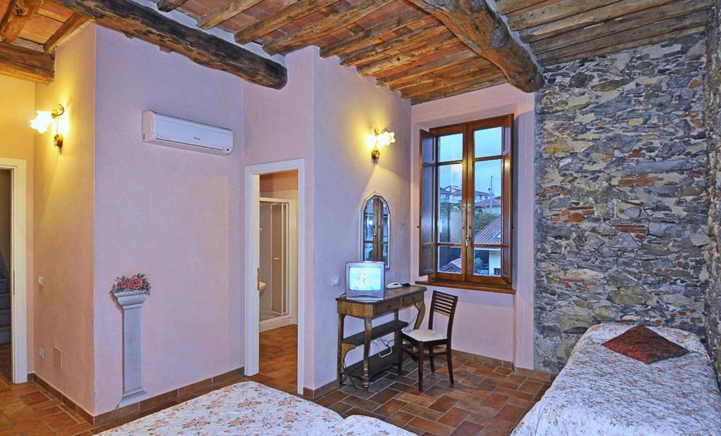 A bed or beds in a room at Le Ginestre B & B