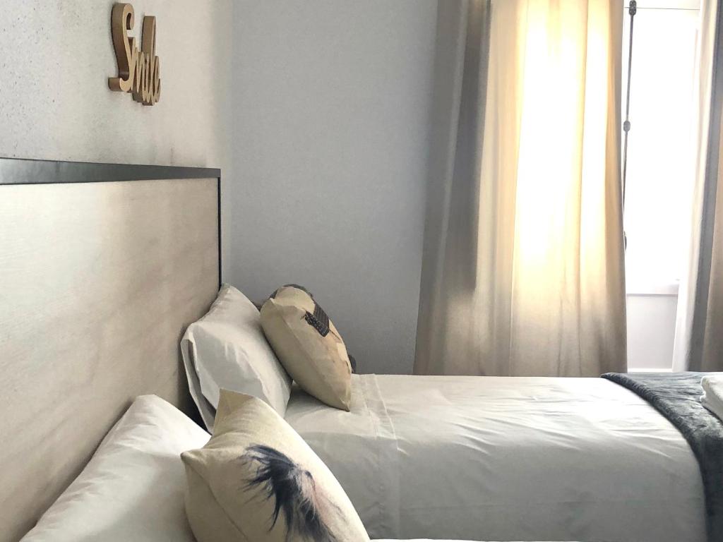 Postel nebo postele na pokoji v ubytování GATU PREMIUM Villa Aramburu, " Preferente mayores de 25 años y familias "