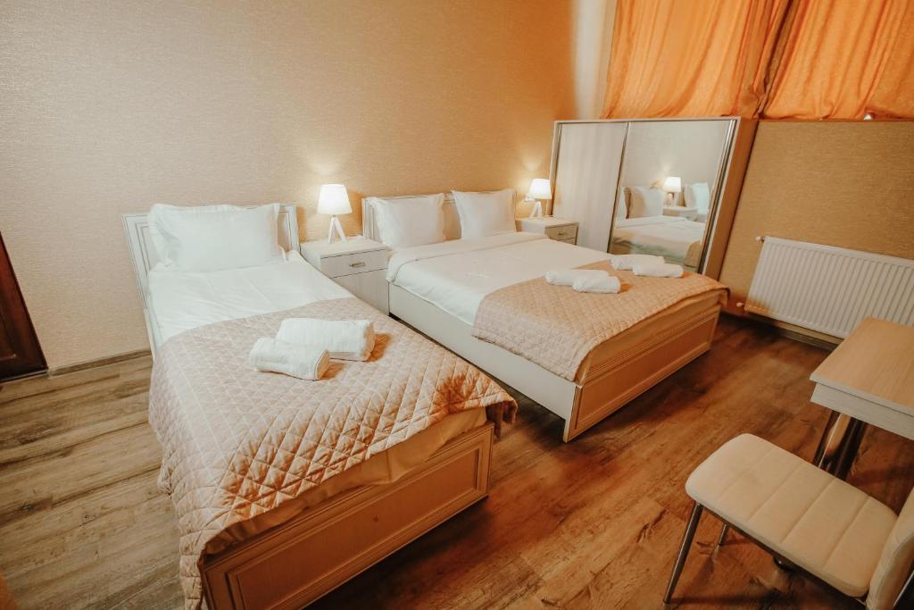 Postel nebo postele na pokoji v ubytování SResidence