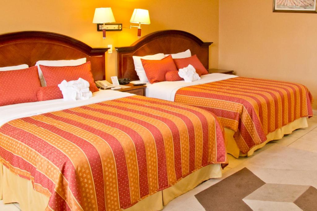 Cama o camas de una habitación en Hotel Monteolivos