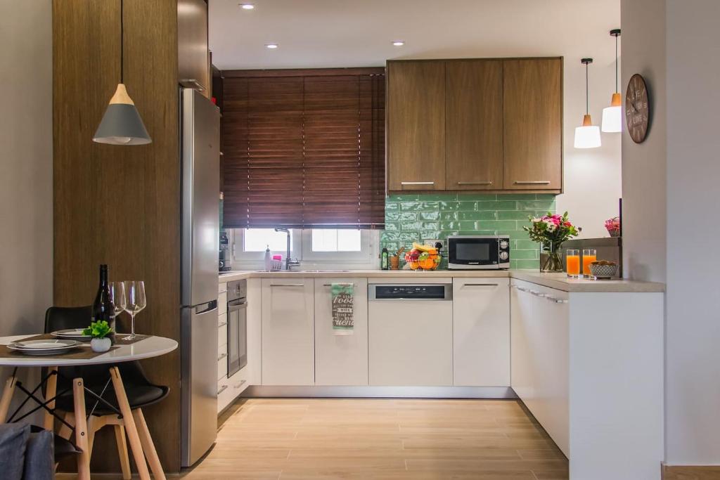 Kuchyňa alebo kuchynka v ubytovaní Central Green Apartment