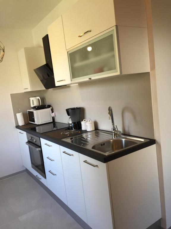 Kuchyňa alebo kuchynka v ubytovaní Apartments & Room Piutti