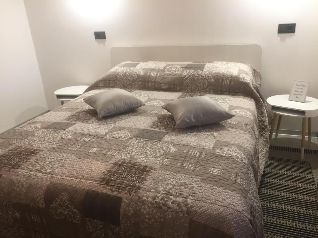 Posteľ alebo postele v izbe v ubytovaní Apartments & Room Piutti