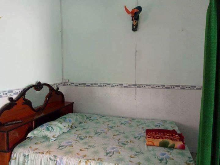 Postel nebo postele na pokoji v ubytování Nhà Trọ Kim Ánh