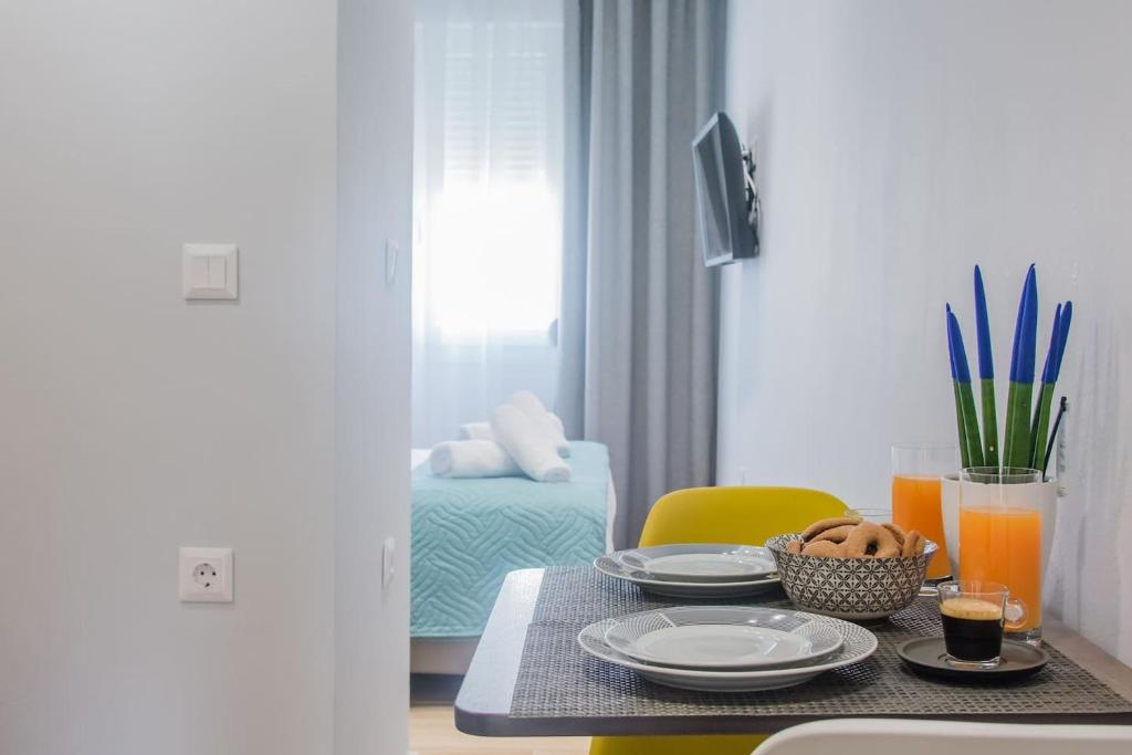 A bed or beds in a room at Central Green Studio