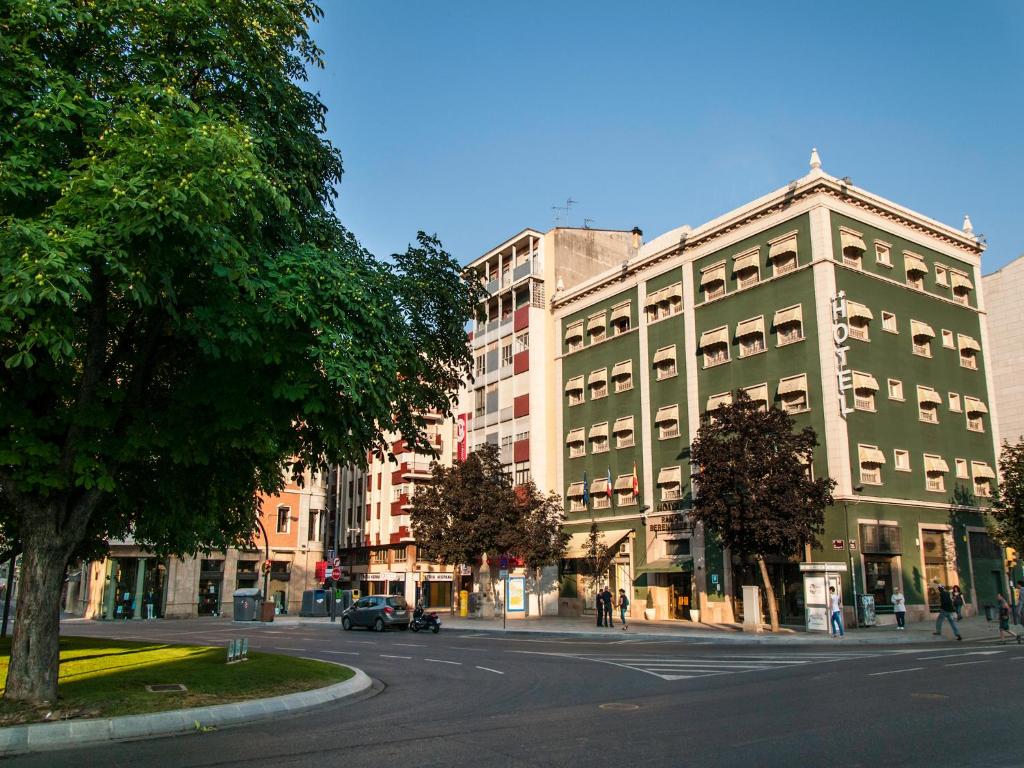 a city street with a large building and trees at Ramon Berenguer IV in Lleida