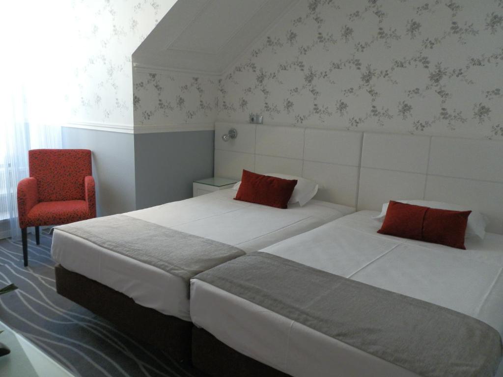 Postel nebo postele na pokoji v ubytování Hotel Florescente
