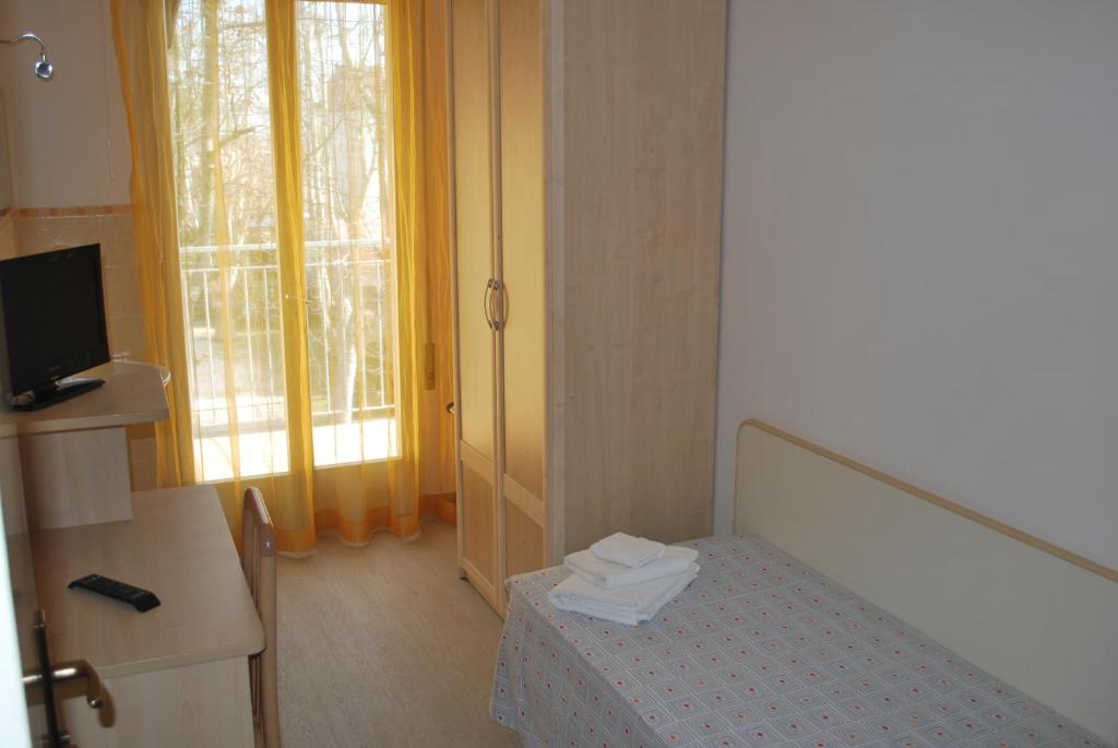 Postel nebo postele na pokoji v ubytování Hotel Cristoforo Colombo