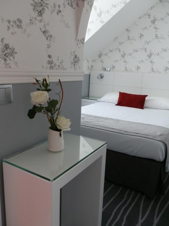 Postel nebo postele na pokoji v ubytování Hotel Florescente