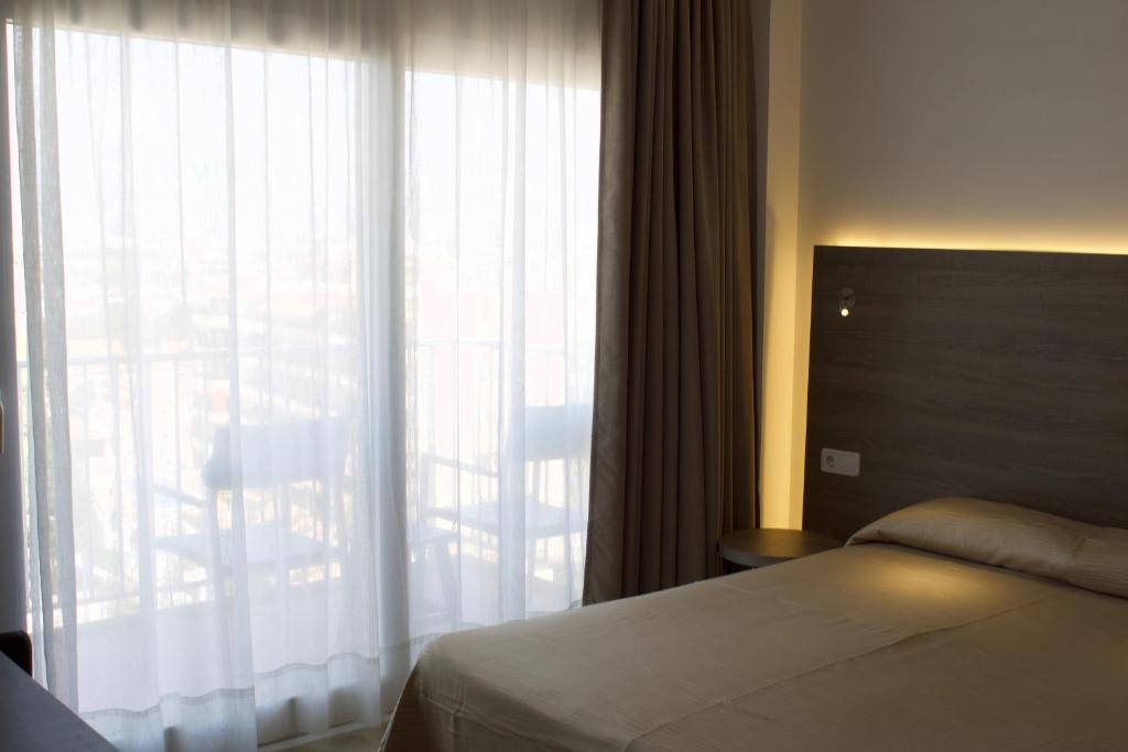 Postel nebo postele na pokoji v ubytování Hotel Vista Odin