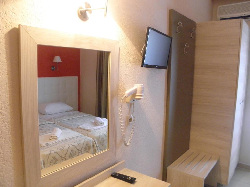 Postel nebo postele na pokoji v ubytování Makedonia Hotel