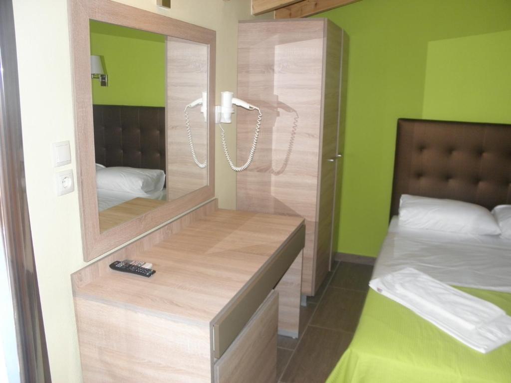 Postel nebo postele na pokoji v ubytování Makedonia Hotel