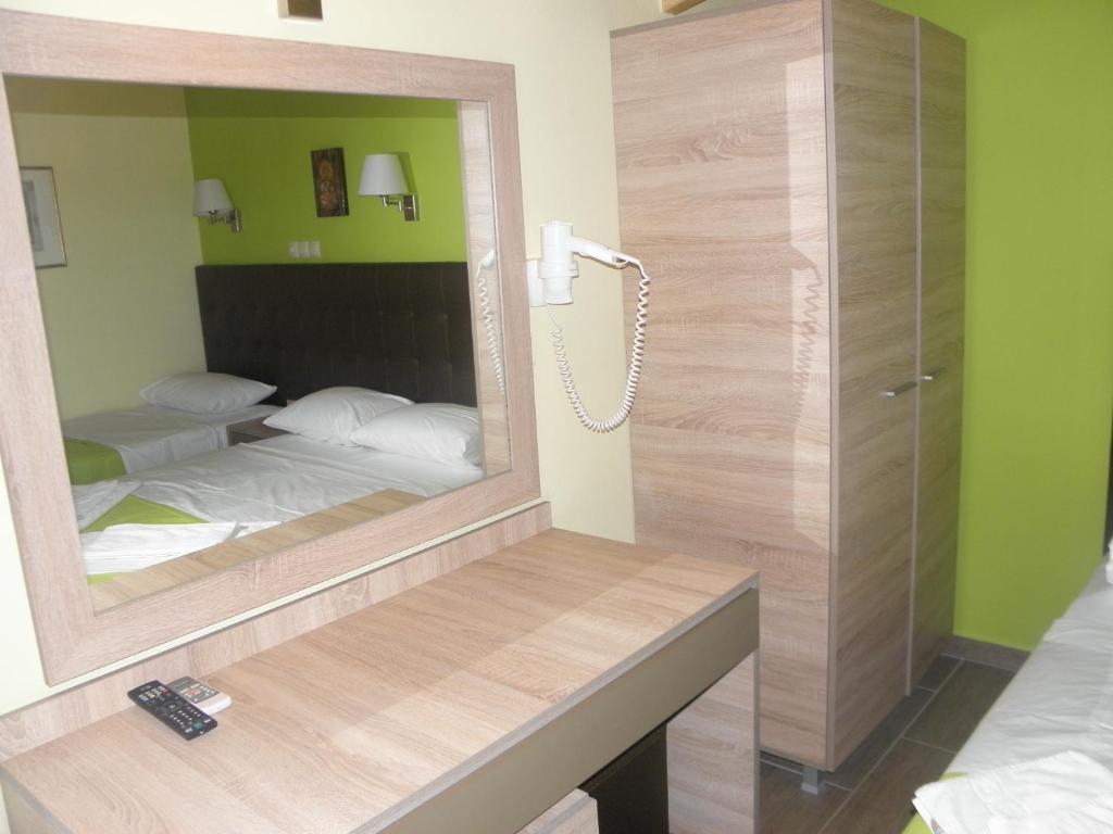 Postel nebo postele na pokoji v ubytování Makedonia Hotel