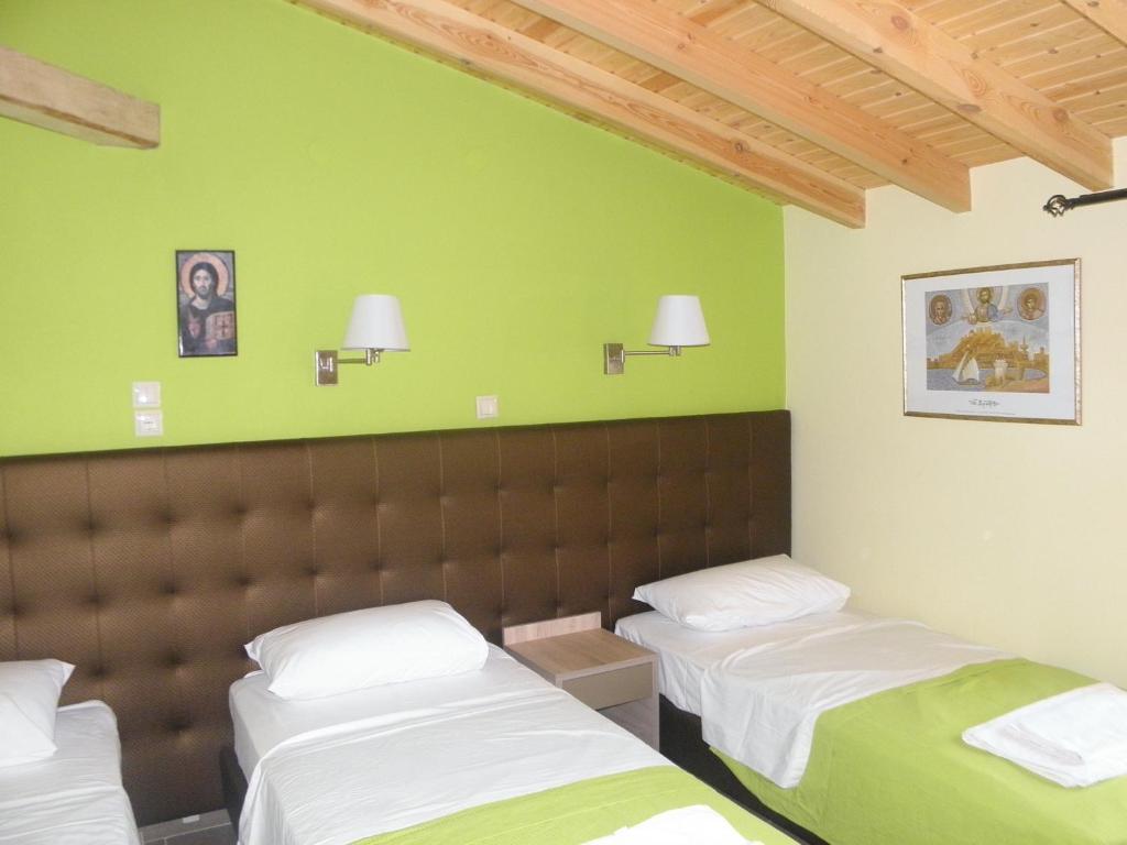 Postel nebo postele na pokoji v ubytování Makedonia Hotel