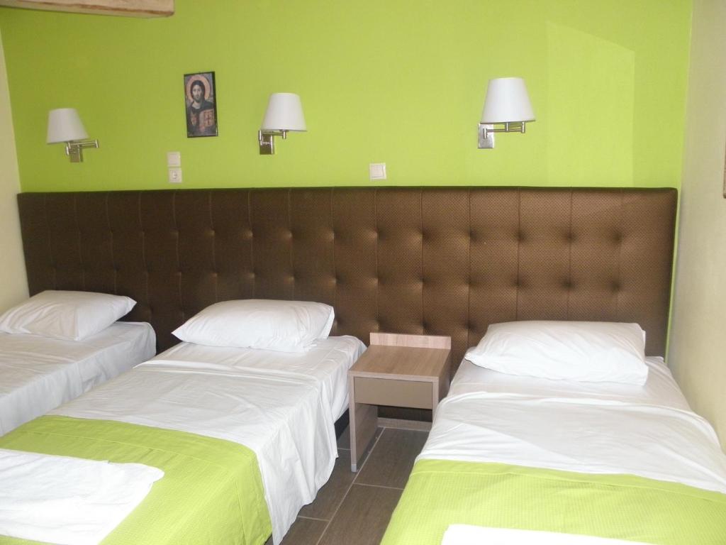 Postel nebo postele na pokoji v ubytování Makedonia Hotel