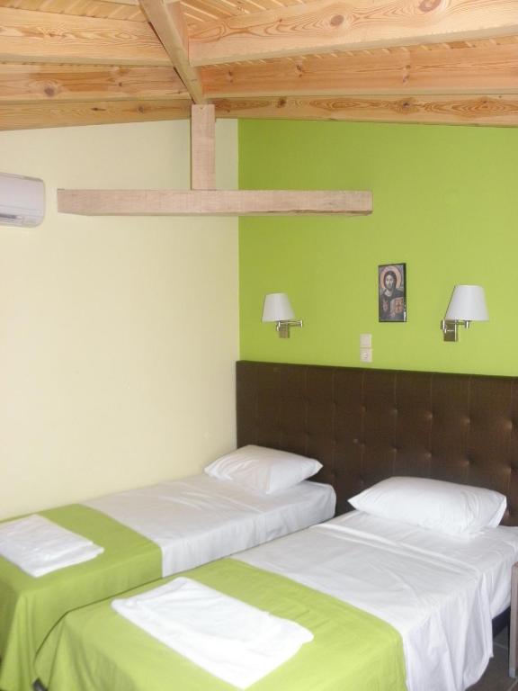Postel nebo postele na pokoji v ubytování Makedonia Hotel