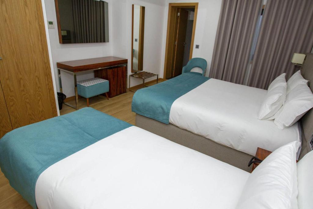 Postel nebo postele na pokoji v ubytování Hotel Fafense