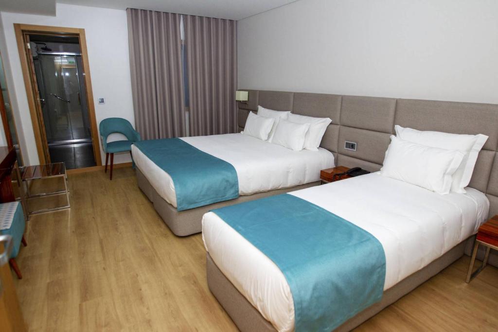 Postel nebo postele na pokoji v ubytování Hotel Fafense