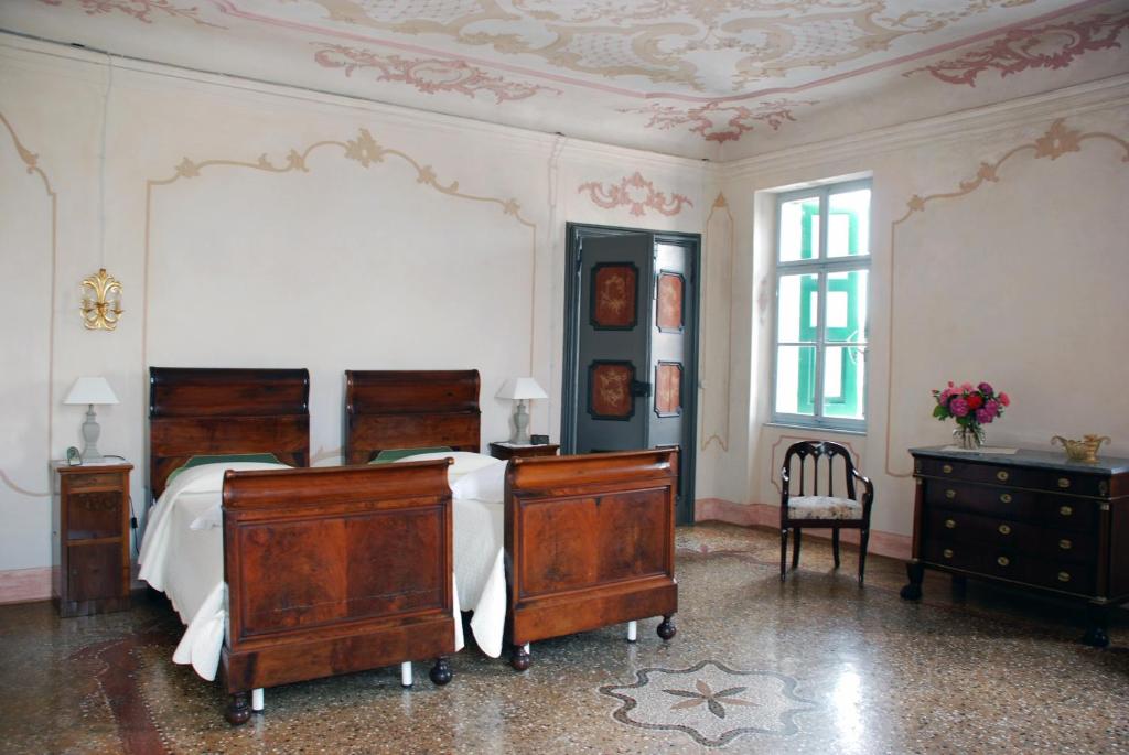 Postel nebo postele na pokoji v ubytování Borgo Palazzo Steffaneo