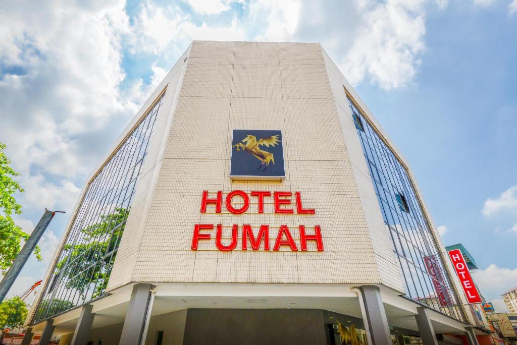 a hotel human sign on the side of a building at Fumah Hotel Kepong in Kuala Lumpur