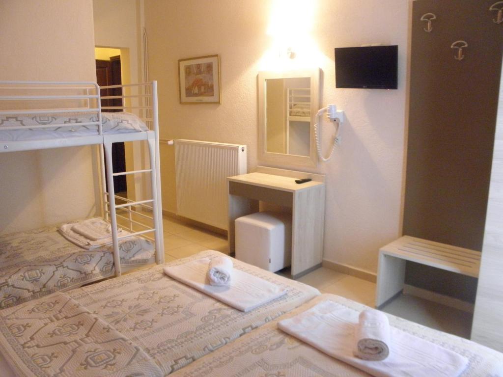 Postel nebo postele na pokoji v ubytování Makedonia Hotel