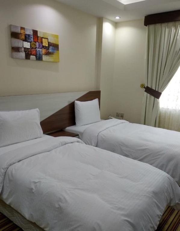 Postel nebo postele na pokoji v ubytování F & H Hotel