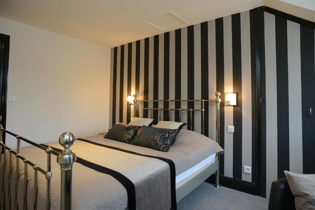 Postel nebo postele na pokoji v ubytování La Ferme des Mares, Demeures & Châteaux